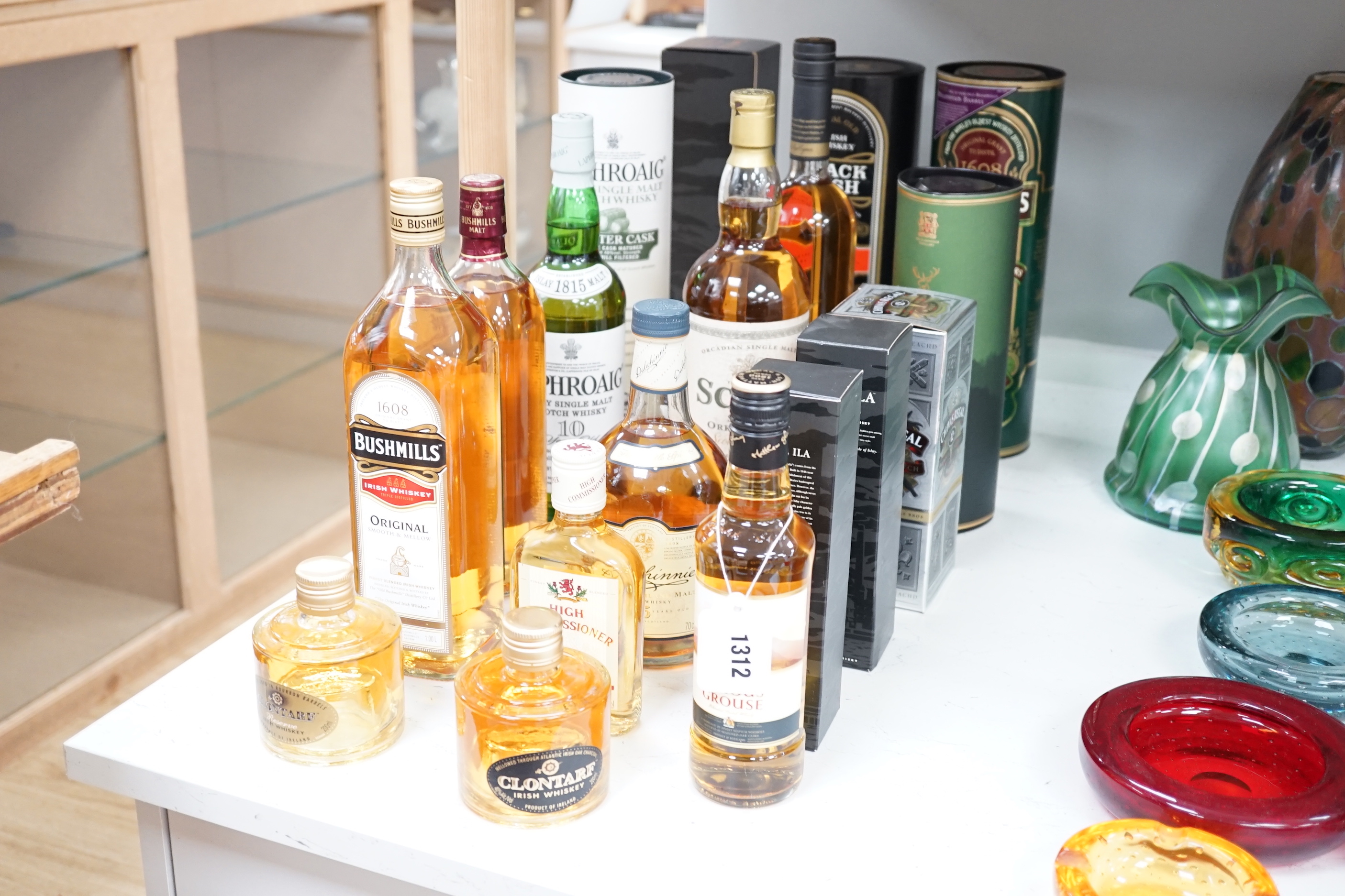 Seventeen bottles of mixed Irish and Scotch whiskies including Laphroaig, Bushmills, Glenfiddich etc.